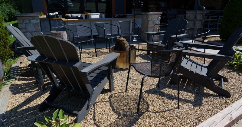Exterior, seating area, chairs around the fire pit