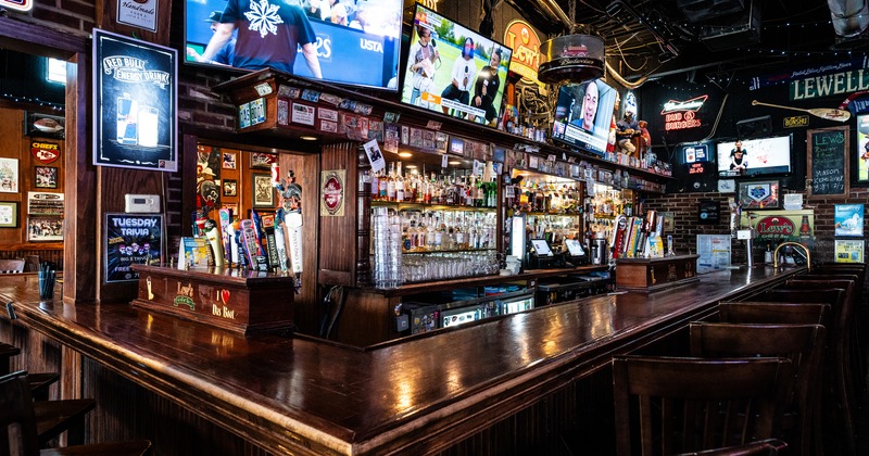Bar angle, drink rack, tv screens above