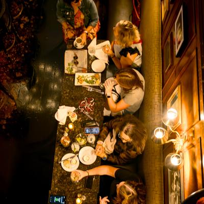 An overhead shot of five patrons dining at the restaurant.