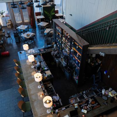 A view of a bar and seating area from the upstairs.