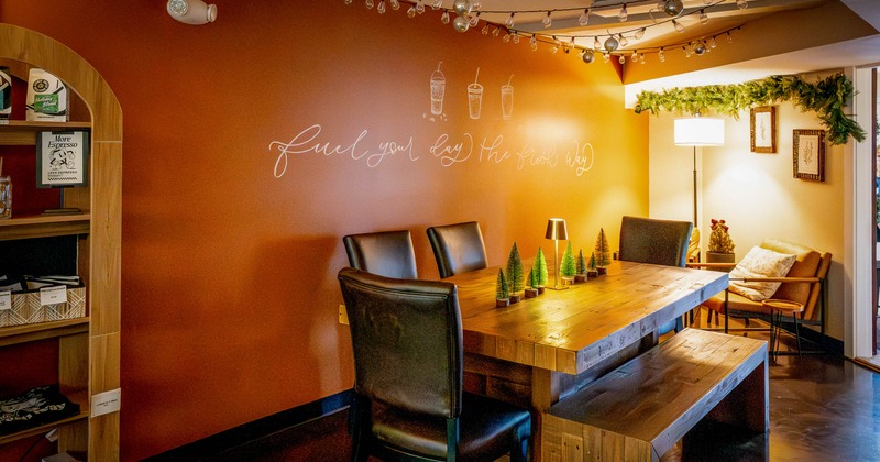 Interior, table with Christmas trees  and chairs
