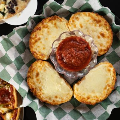 Garlic Cheese Bread with dipping sauce on the side.