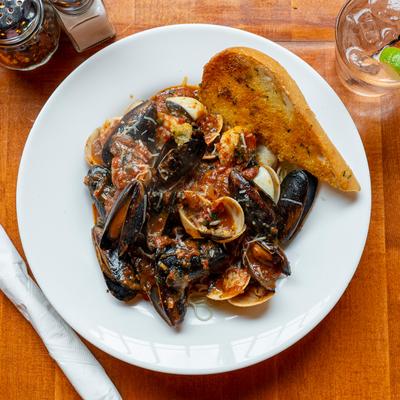 Seafood sauteed in marinara sauce, served with garlic bread.
