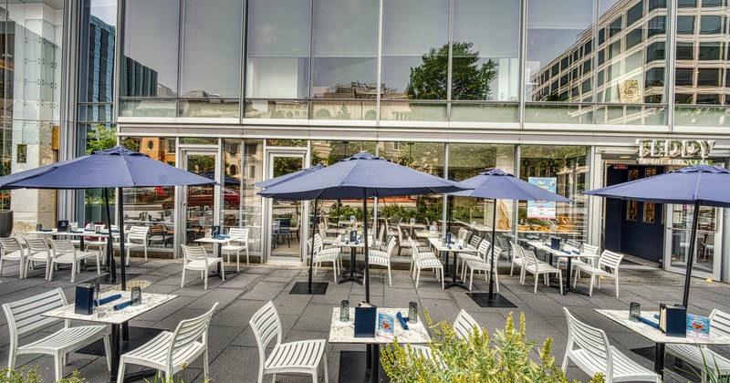Exterior seating area with parasols, tables and chairs