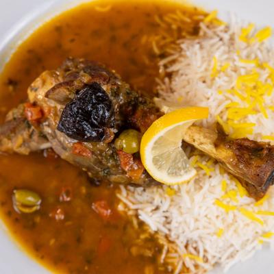Braised tender lamb shank, with spices, and rice.
