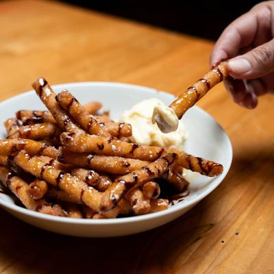 Funnel fries, served with a scoop of vanilla ice cream.