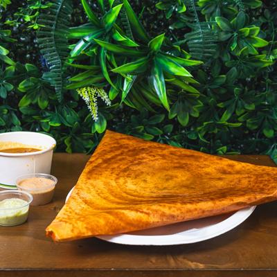 Masala dosa served withy chutneys.