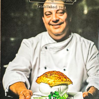 Chef presenting a gourmet dish