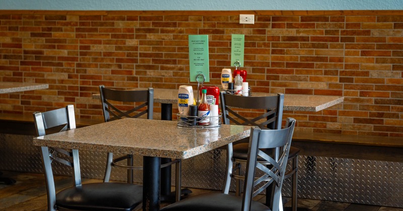 Interior, dining area, marble top table for two, condiments tray on the table