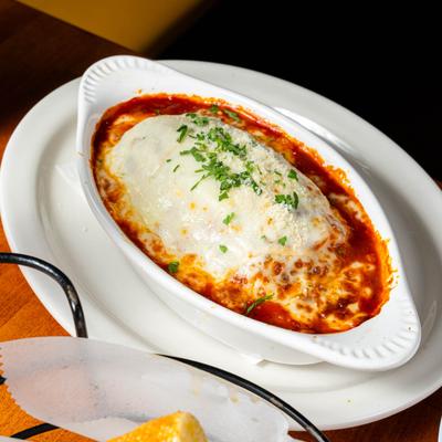 A served lasagna, single portion.