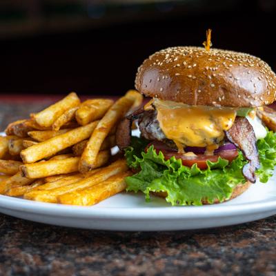 The Traditional American Cheeseburger served with fries.
