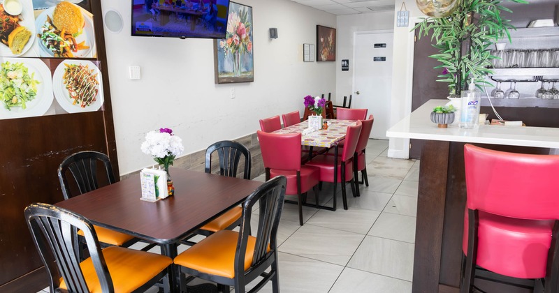 Interior, dining area, tables for six and four, ready for guests