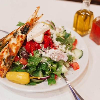 Greek salad served with pita bread
