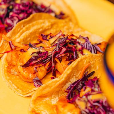 Shrimp tacos with purple cabbage.