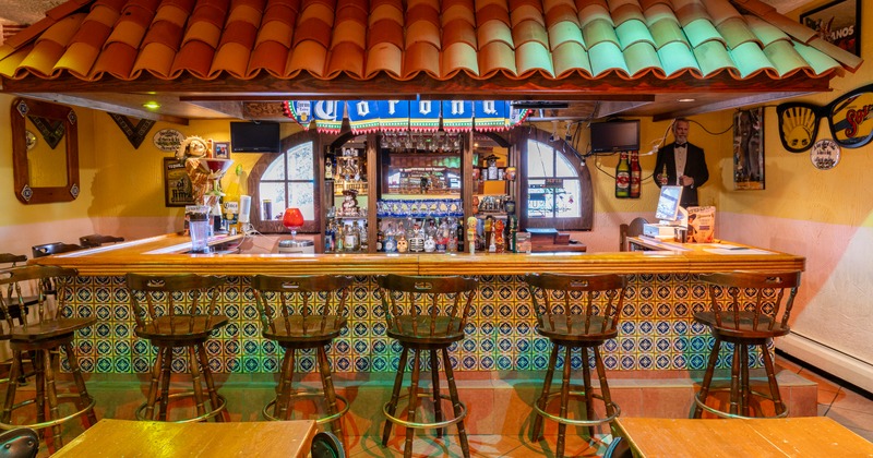 Interior, bar with wooden high stools