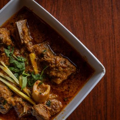 Goat Karahi, with ginger, garlic, spices, and tomato and onion gravy.