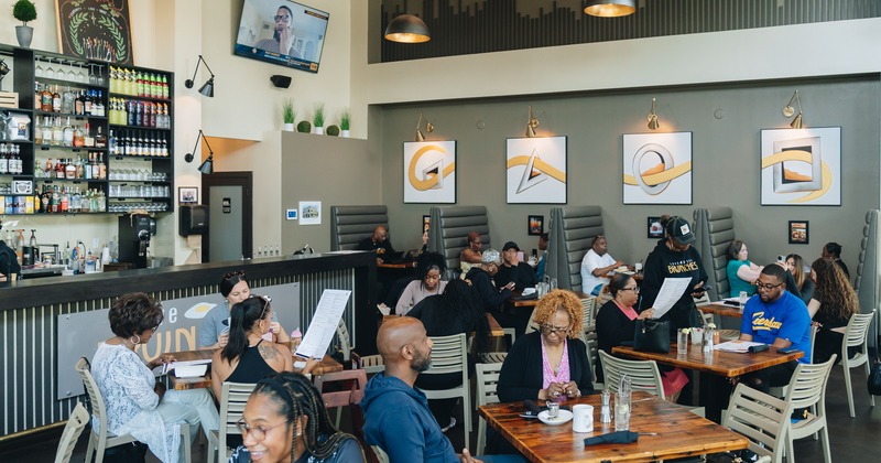 Interior, diner area, tables, chairs, people seating