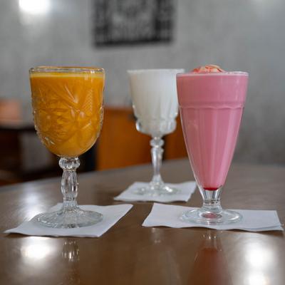 Variety of colorful drinks served on the table.