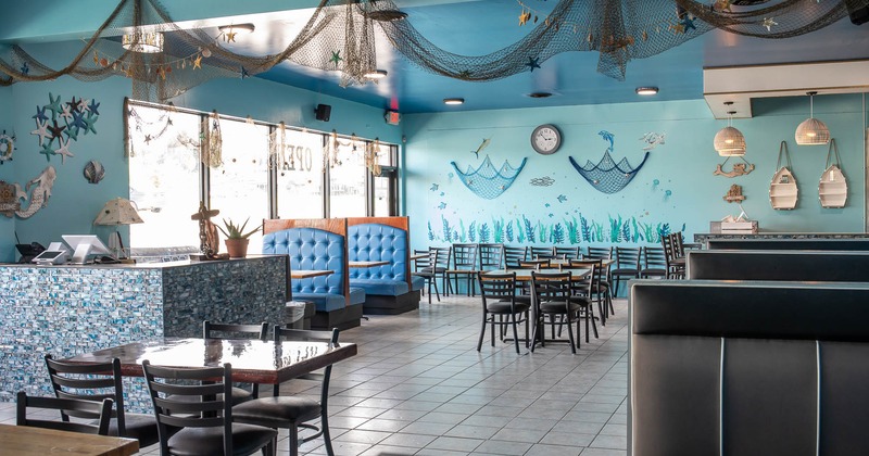 Interior, tables and chairs in dining area