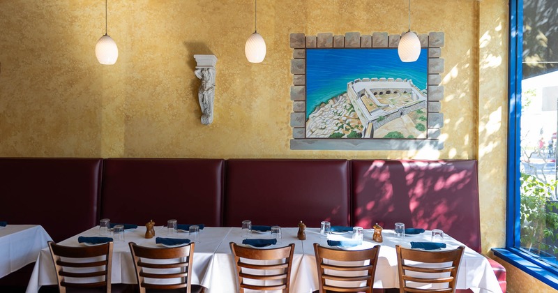 Interior, tables near window set for guests