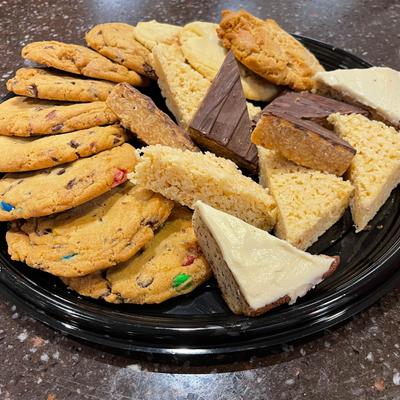 A platter with monster cookies and specialty bars.