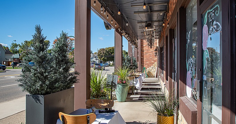 Outdoor dining area in front of the restaurant entrance