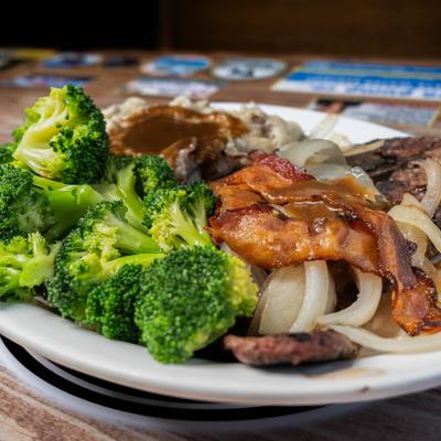 Baby Beef Liver, with onions, bacon, beef gravy, mashed potatoes, and broccoli.