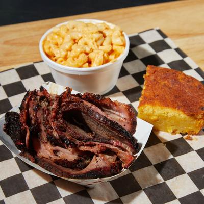 Smoked brisket, served with cornbread, and Mac and Cheese.