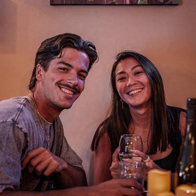 A couple sitting together at a table.