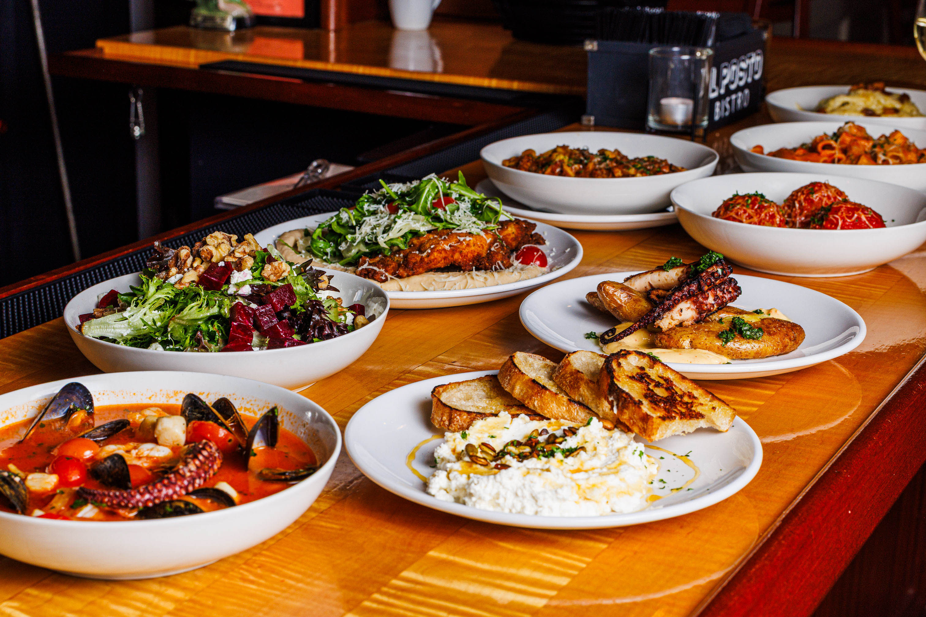 Assorted Italian dishes on a wooden table