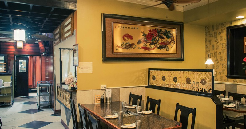Interior, dining place near wall decorated with picture