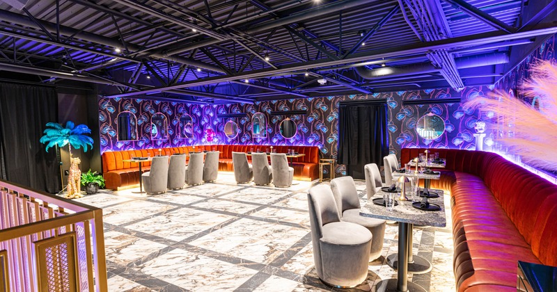 Interior, upholstered chairs and benches, tables, decorative wallpaper, ceiling