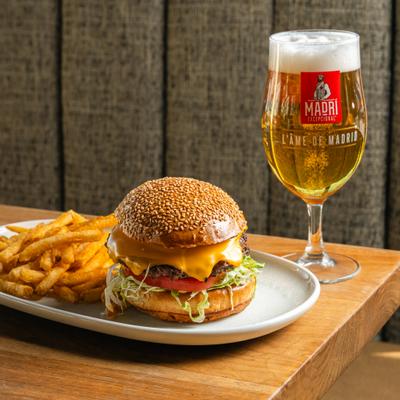 Burger Royale with fries, alongside a glass of beer.