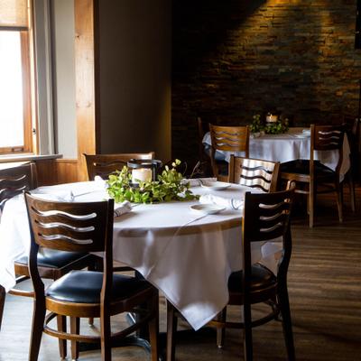 Interior, round dining tables, fully set