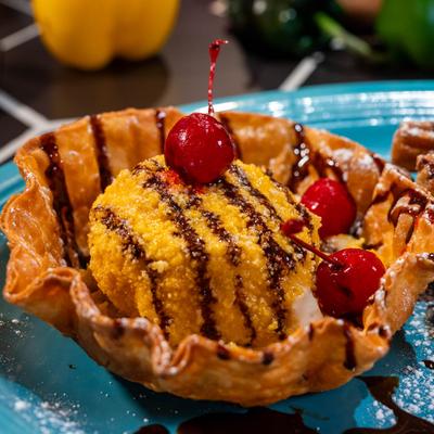 Fried ice cream topped with cherries.