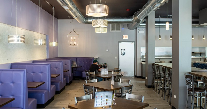 Interior, restaurant booths and lined up dining tables