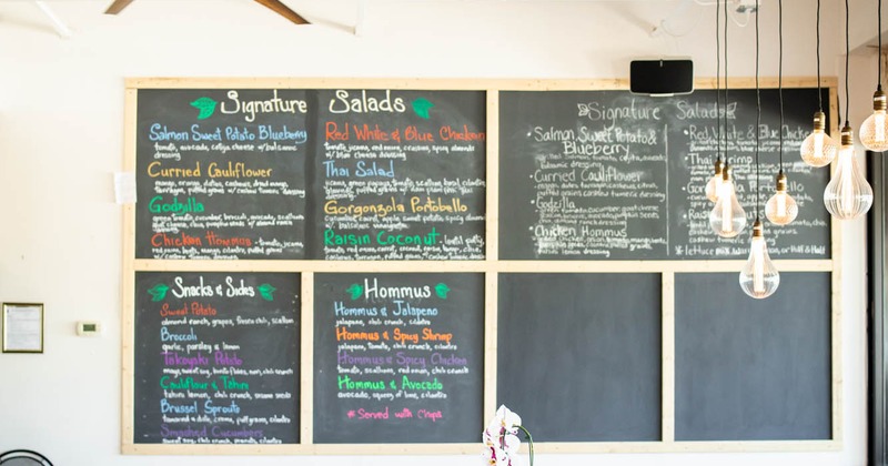 Inside, chalkboard menu on a wall