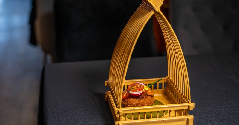 Crab cake in a wooden serving intricate tray