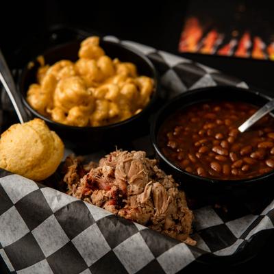 Pulled pork, BBQ beans, corn muffin, mac and cheese.