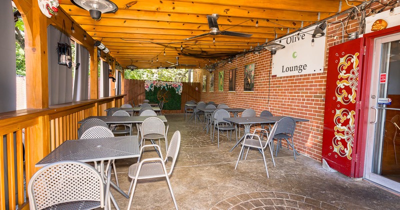 Covered patio area wit ceiling fans