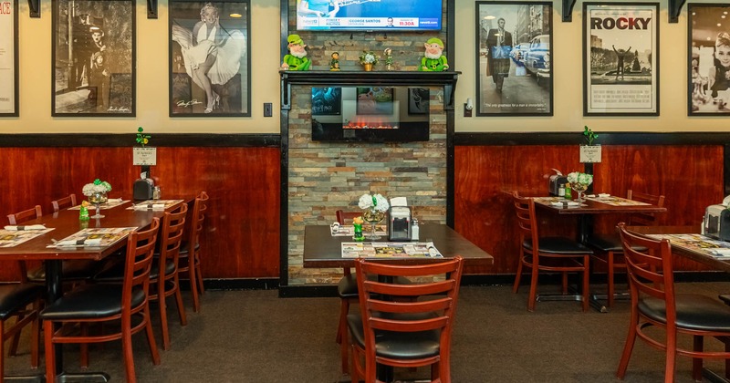 Interior, tables and chairs, framed pictures on the wall