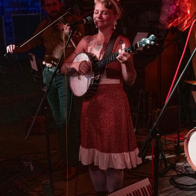 Musician playing banjo.