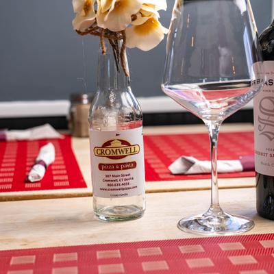 Drinks and flowers on a table.