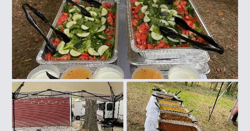Two trays of salad with tomatoes, lettuce, and cucumbers