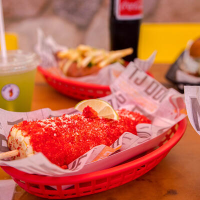 Grilled corn with dip on top