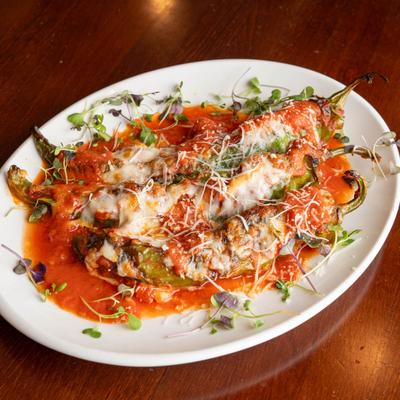 Italian hot peppers stuffed with sweet sausage and smoked mozzarella, topped with  marinara sauce.