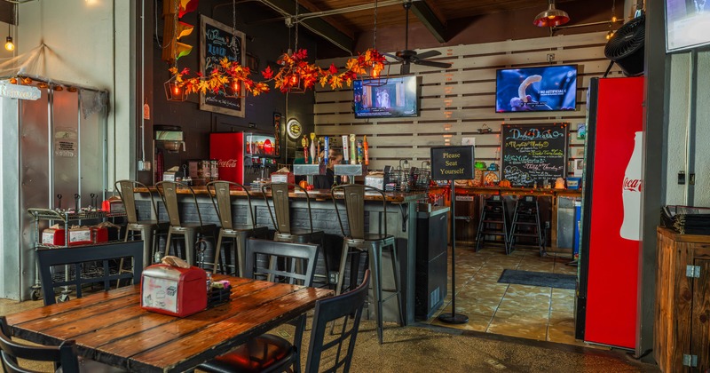 Interior, seating area with a bar in the back