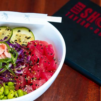 Sushi grade tuna, cucumber, carrots, ginger, & green onions over rice.