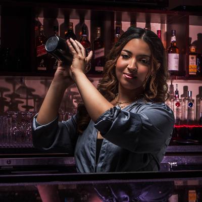 Bartender mixing a cocktail.