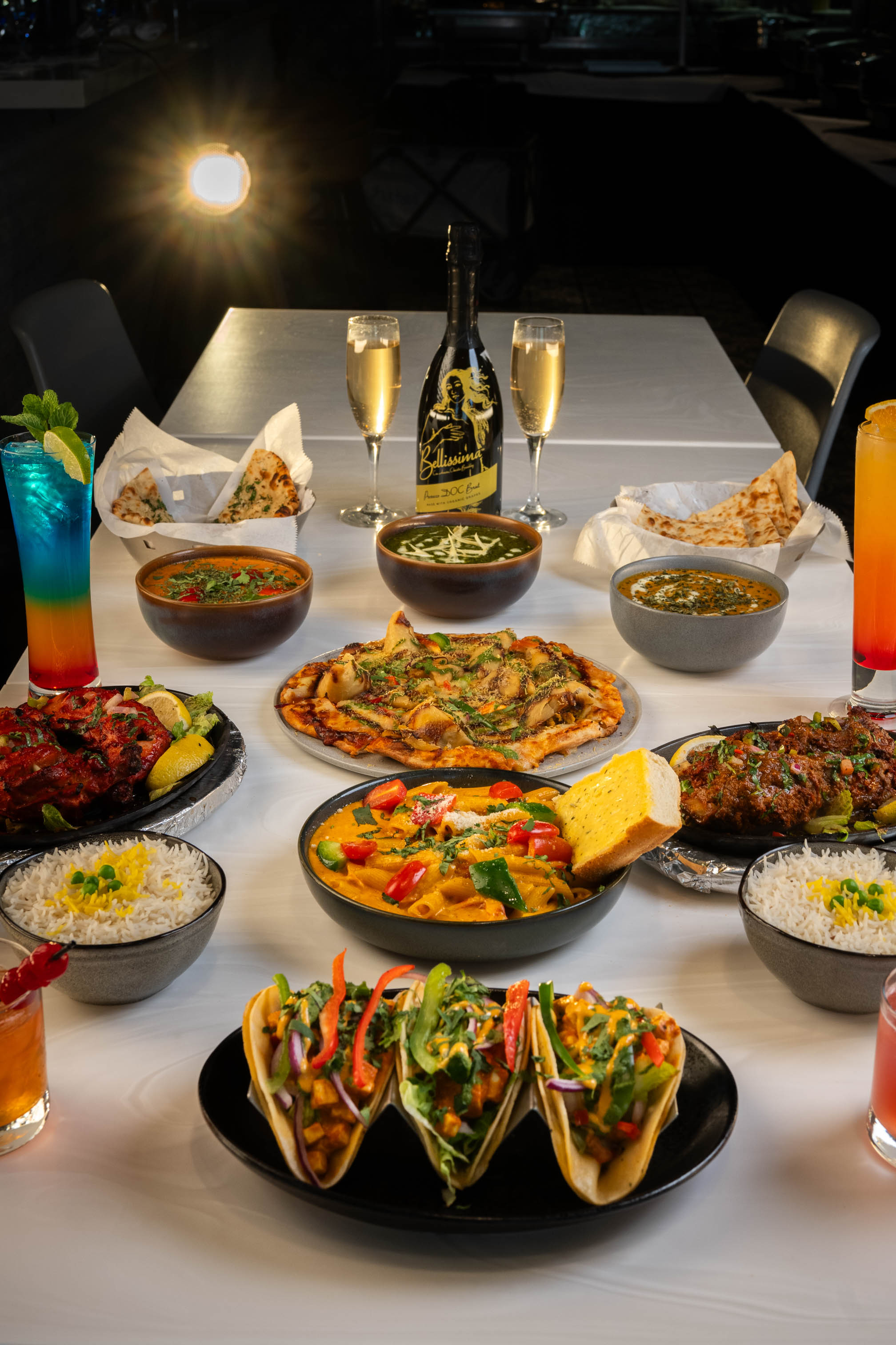 Various food items served on the table wuth drinks